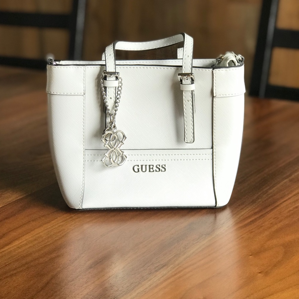 Guess - White hand purse w/ optional long strap.